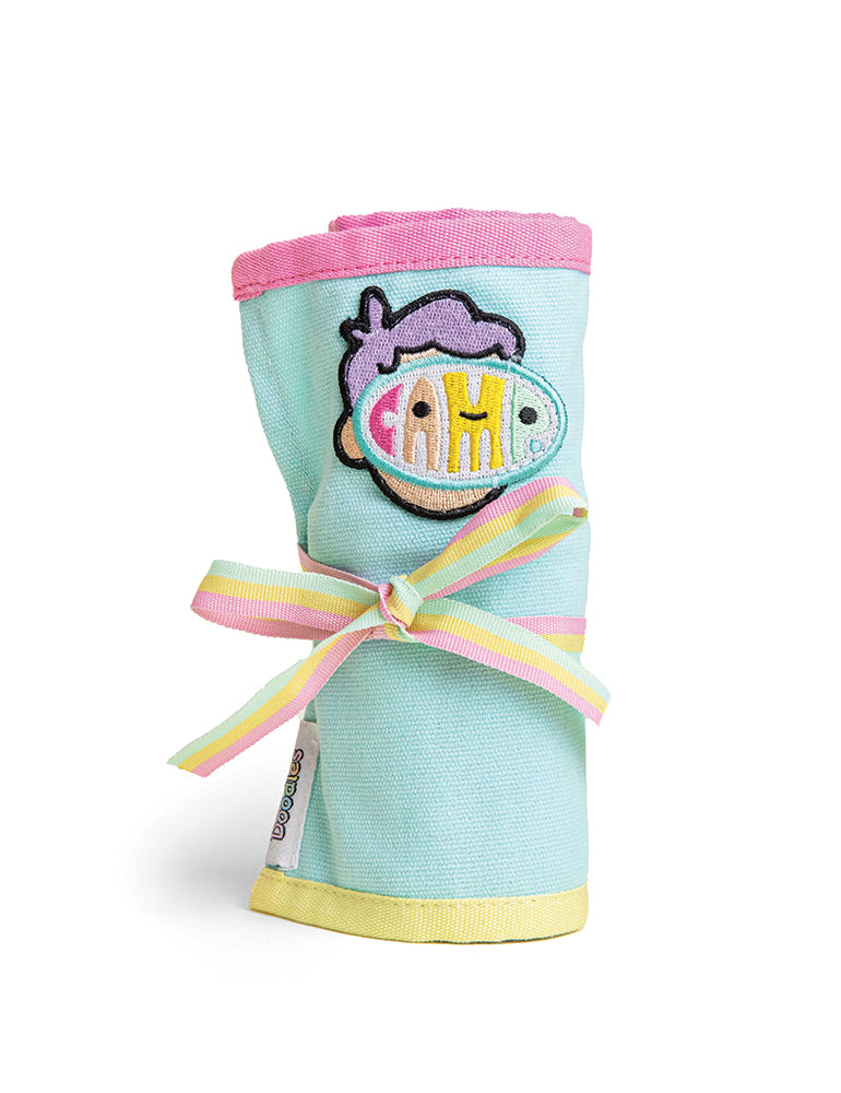 CAMP x Doodles Canvas Marker Roll featuring durable canvas material, vibrant design, and secure tie closure for art supplies. Tied up.